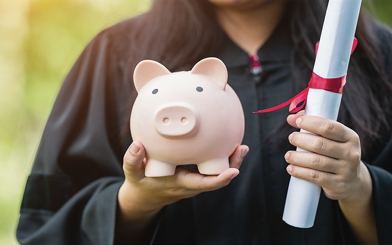 Canadian nursing student holding piggy bank and graduation certificate